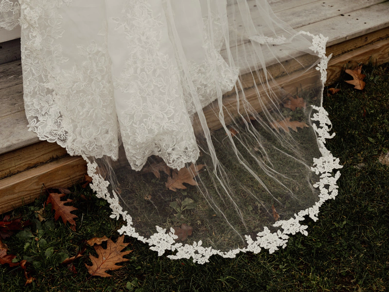 wdding dress coming down from the wood floor